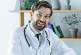 cheerful young doctor making notes 23 2147896147 1